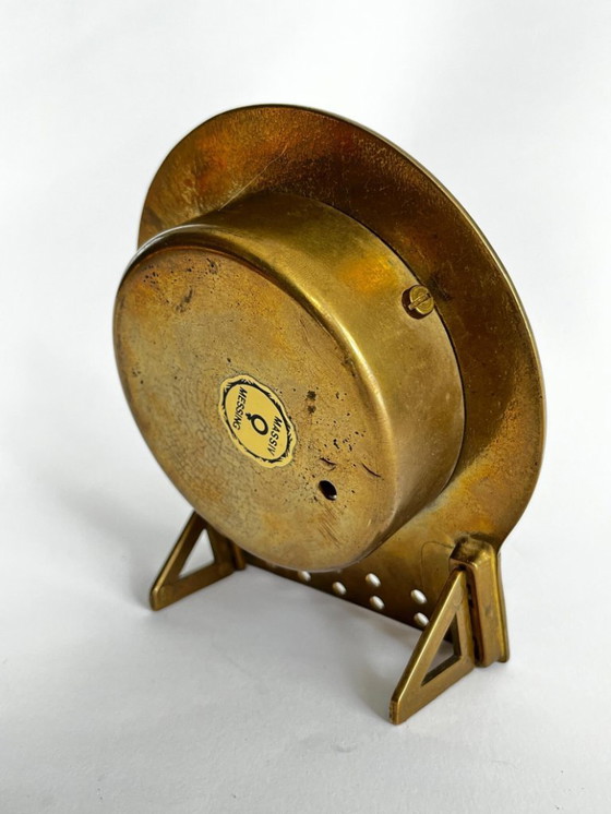 Image 1 of Mid-century brutalist brass zodiac desk clock met datumkalender – 1960s West Germany