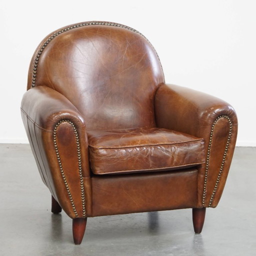 Fauteuil en cuir de boeuf aux formes arrondies