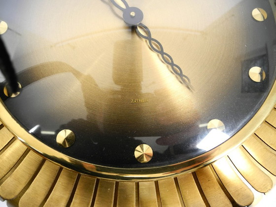 Image 1 of Beautiful original Mid Century Sunburst Atlanta Universe wall clock made of heavy brass with a mechanical seven-day movement