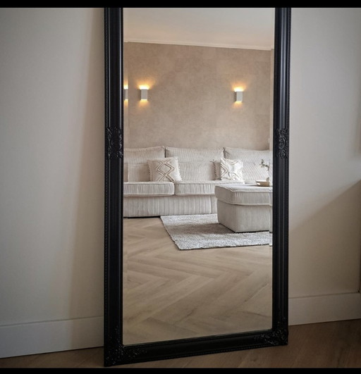 Large black hotel chic mirror with facet