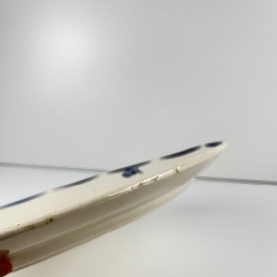 Image 1 of Piatto ovale in semiporcellana di Badonviller, decorato con motivi floreali blu, inizio XX secolo.