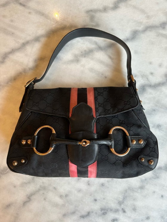 Image 1 of borsa con morsetto per cavalli