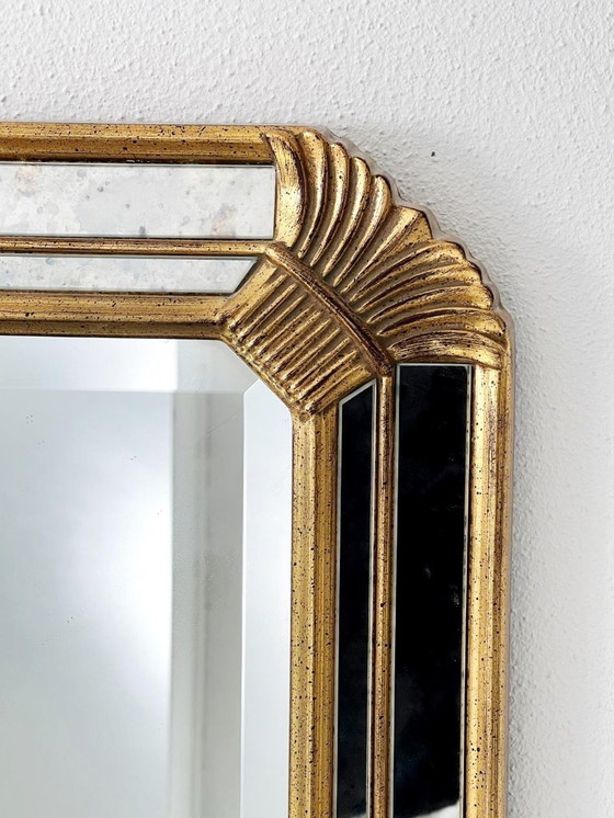 Image 1 of Vintage Deknudt trapezoid mirror – gold frame with smoked mirror glass – Hollywood Regency style – 95 × 69 cm