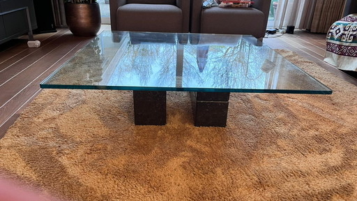 Glass coffee table with solid granite base