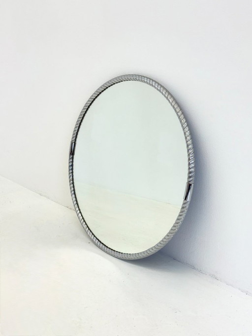 Round vintage mirror with tubular frame