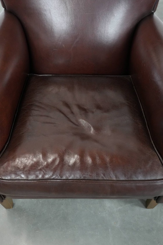 Image 1 of 2 x Schaffellsessel mit zeitlosem Look und wunderschönen dunklen Farben