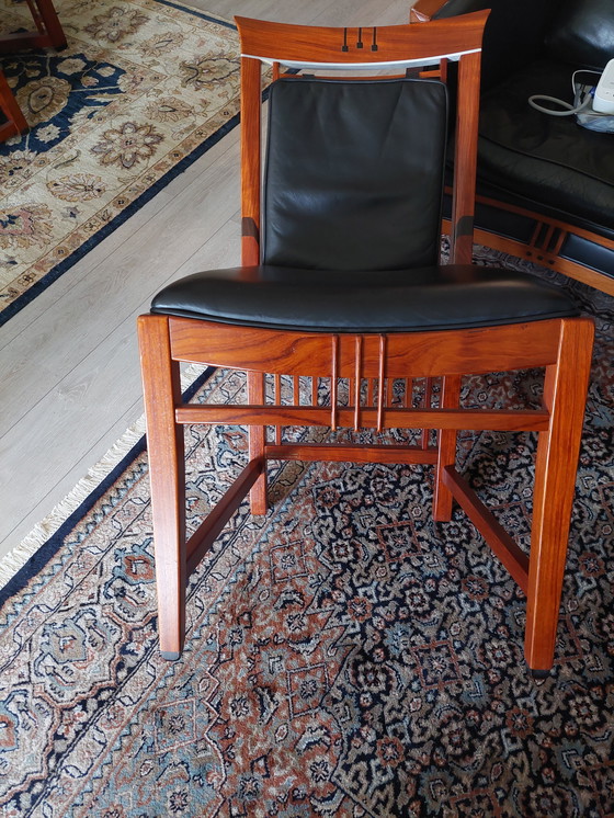 Image 1 of Rectangular long dining table with four luxurious leather-upholstered chairs by Schuitema Stadskanaal. In very good condition.