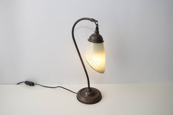 Image 1 of Vintage brass table lamp with curved arm and glass shade