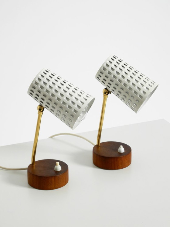 Image 1 of A pair of beautiful mid-century modern bedside lamps with perforated metal shades and teak wood bases