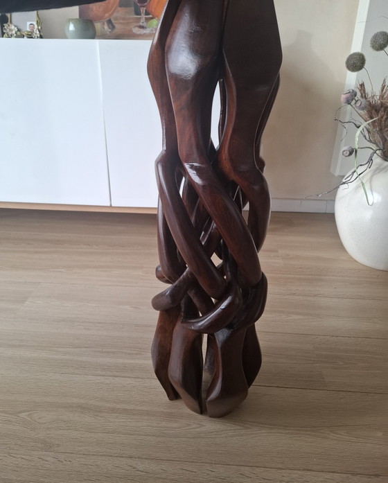 Image 1 of Interlocking African "unity" table.