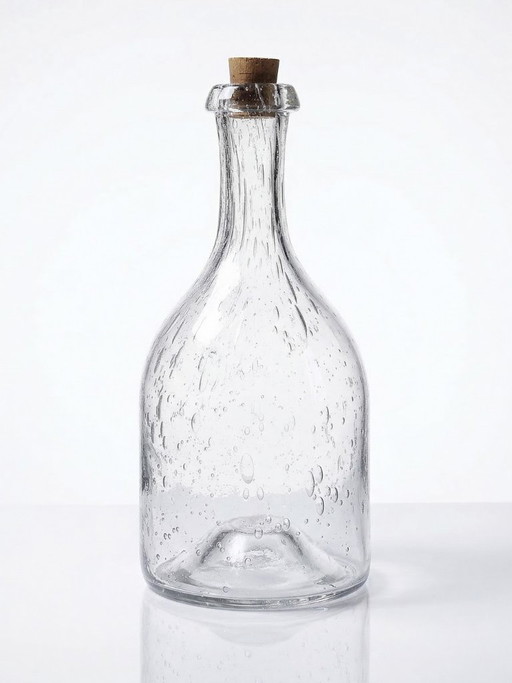 Large antique bottle in blown glass with bubbles, early 20th century, 1900-1920