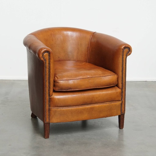 In good condition sheep leather club chair