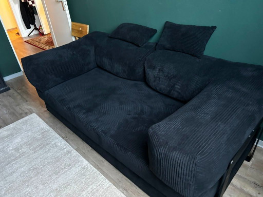 Zwarte designbank Lazy 3-zitsbank in corduroy.