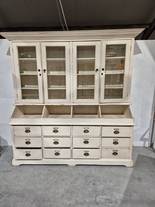 Old rural pine grocery cupboard with cut glass