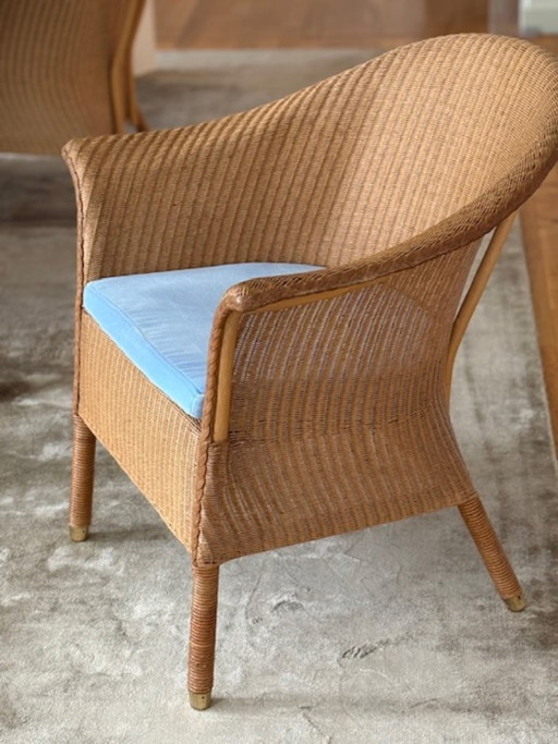 Four Lloyd Loom Chairs and an Ottoman
