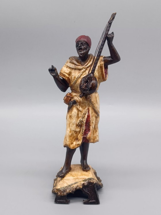 Image 1 of Ecole Orientaliste du XXème siècle, Musicien de rue en métal belle patine