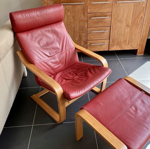 Red leather armchair with footstool