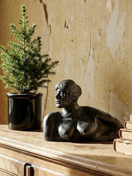 20th-century ceramic bust of a woman, an unidentified piece of art.