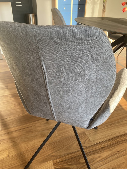 4 X OS stoelen model Hera, spinpoot 360gr.draaibaar retumfunctie stof fijn geweven licht grijs.onderstel zwart.