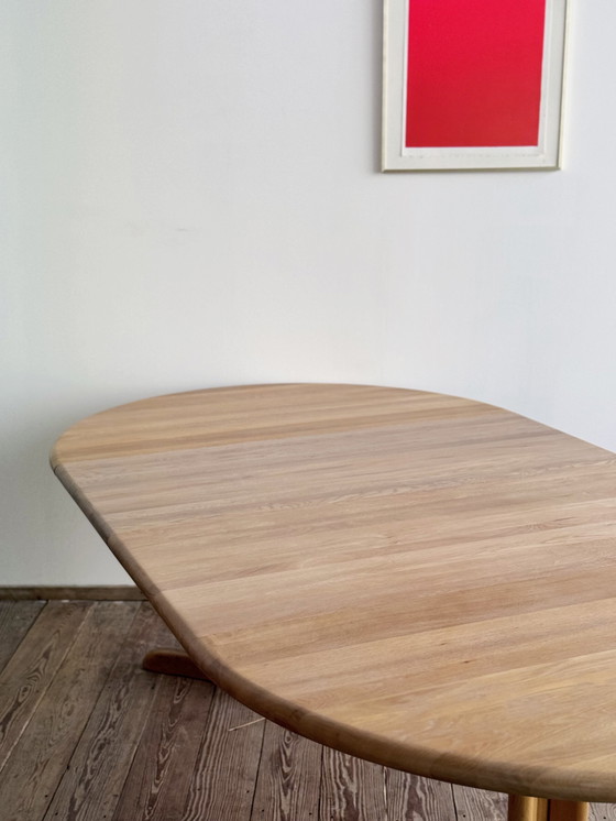 Image 1 of Mid Century Moderne Deense ronde uitschuifbare teakhouten eettafel van Glostrup, 1960