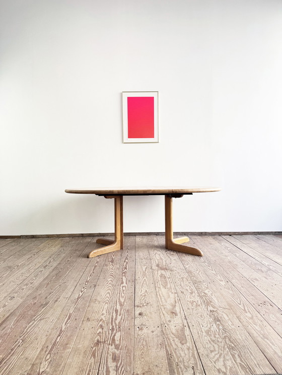 Image 1 of Mid Century Moderne Deense ronde uitschuifbare teakhouten eettafel van Glostrup, 1960