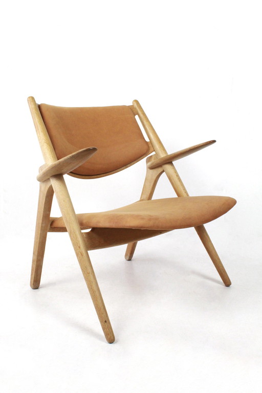 Sawbuck armchair CH28 by Hans J Wegner for Carl Hansen & Son