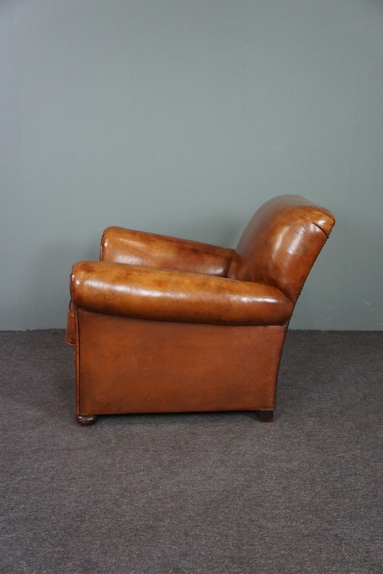 Image 1 of Nieuw gestoffeerde schapenleren fauteuil