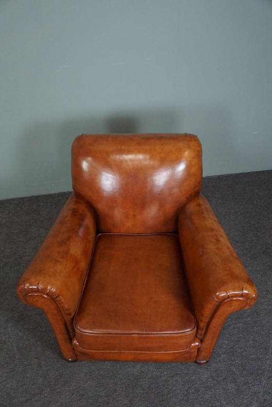 Image 1 of Nieuw gestoffeerde schapenleren fauteuil