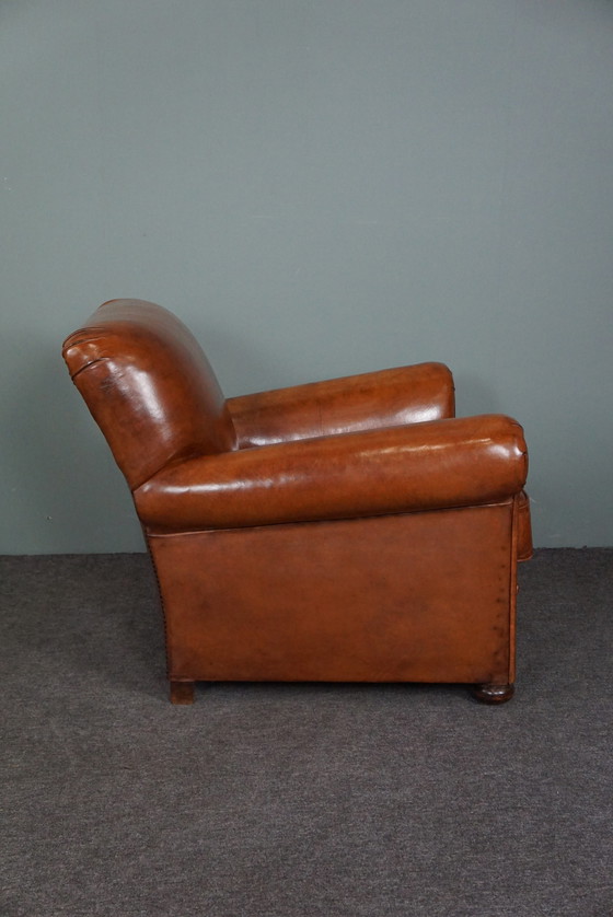 Image 1 of Nieuw gestoffeerde schapenleren fauteuil