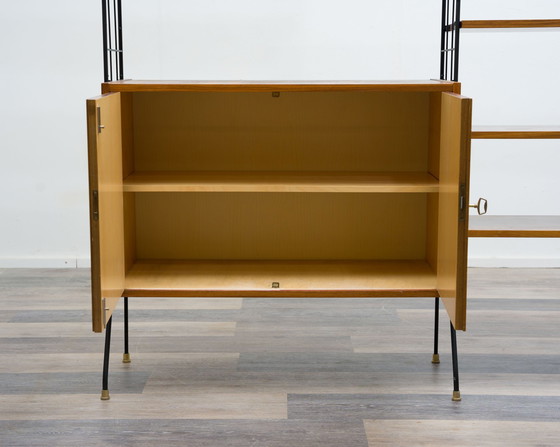 Image 1 of Vrijstaande plank, zwarte metalen ladders, jaren 60