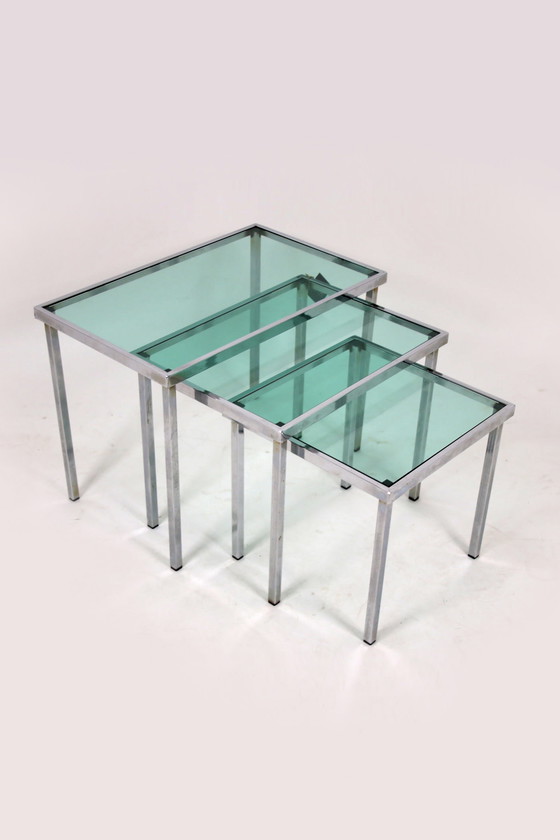 Image 1 of Chrome Bijzet tafeltjes met licht blauw doorzichtig glas