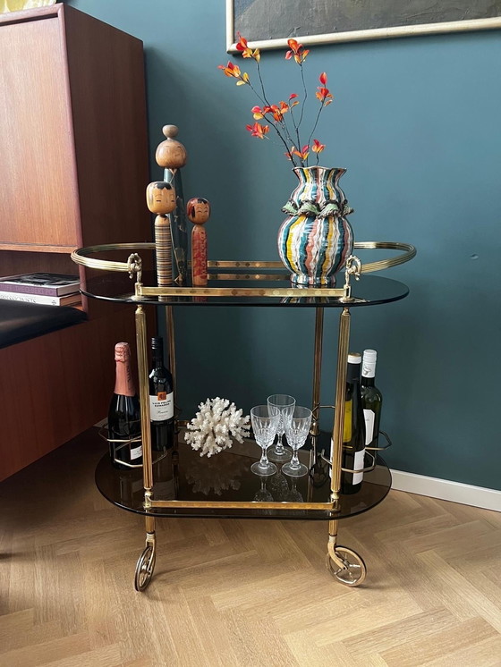 Image 1 of Vintage Messing Barcart Rookglazen Bladen Met Zwenkwielen