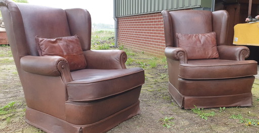 2x vintage leren fauteuils