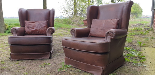 2x vintage leren fauteuils