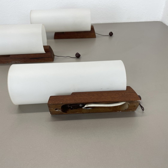 Image 1 of Set van 3 minimalistische wandlampen van satijnwit glas en teakhout, Denemarken, 1960S