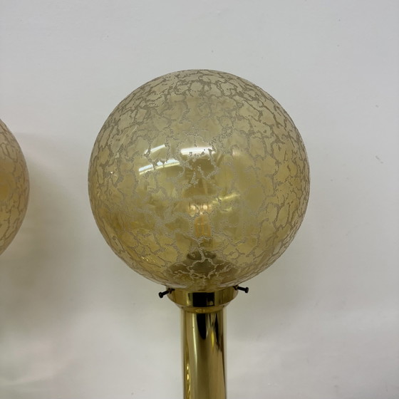 Image 1 of Set van 2 grote glazen bollen tafellampen met messing voet, 1970S