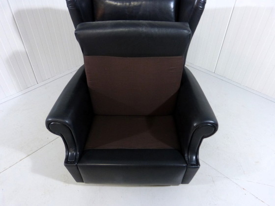 Image 1 of Zwart leren vintage wingback fauteuil op wieltjes 1960's