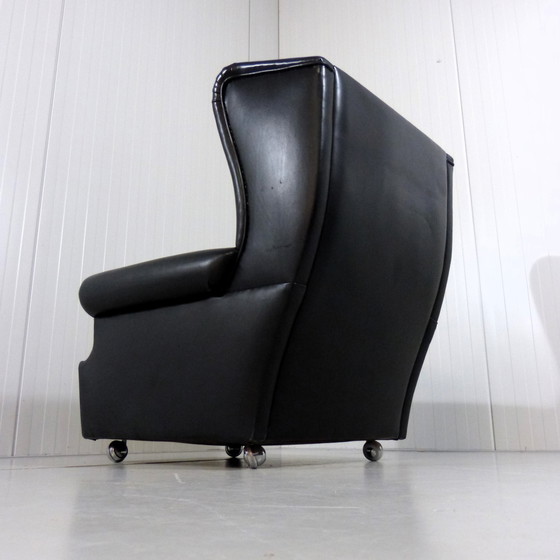Image 1 of Zwart leren vintage wingback fauteuil op wieltjes 1960's