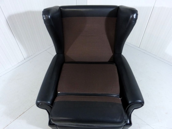 Image 1 of Zwart leren vintage wingback fauteuil op wieltjes 1960's