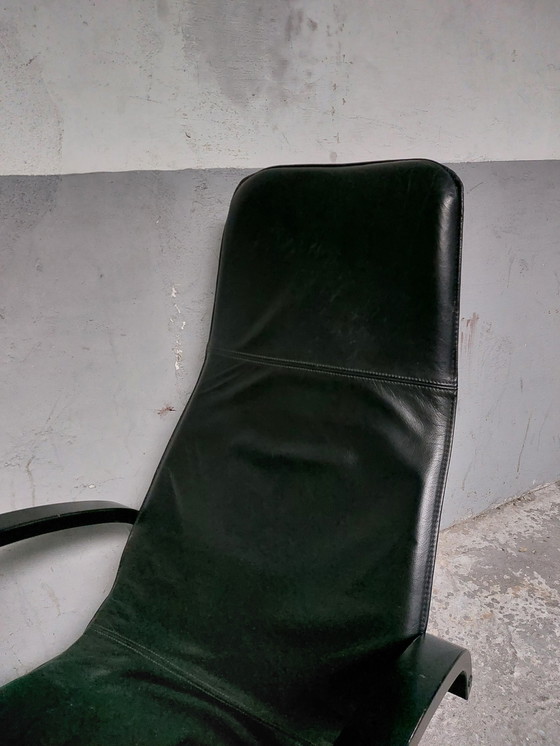 Image 1 of Black leather relax chair + Poef, 1989