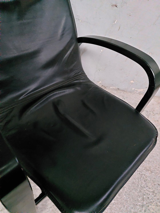 Image 1 of Black leather relax chair + Poef, 1989