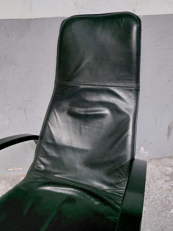 Image 1 of Black leather relax chair + Poef, 1989