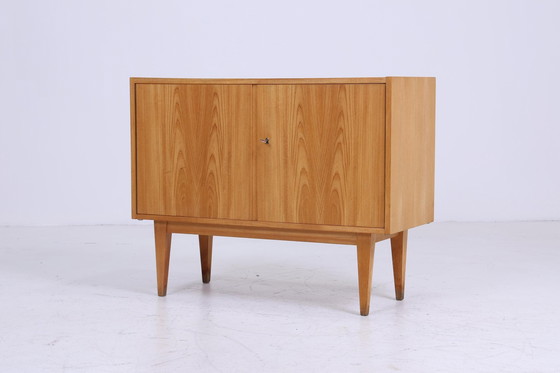 Image 1 of Hellerau 602 | Een ladekast jaren 60 | Mid Century gangkast vintage opbergruimte retro jaren 70 Senesche hout Franz Ehrlich