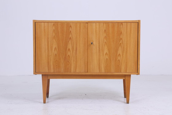 Image 1 of Hellerau 602 | Een ladekast jaren 60 | Mid Century gangkast vintage opbergruimte retro jaren 70 Senesche hout Franz Ehrlich