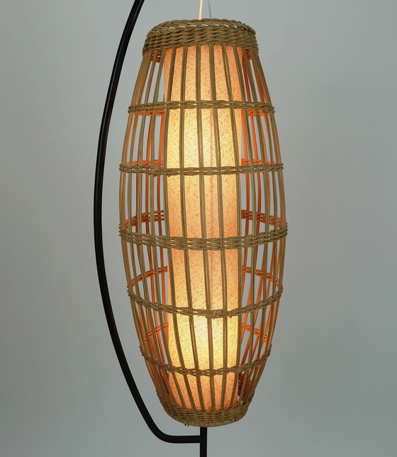 Image 1 of buitengewone en zeldzame Mid century FLOOR LAMP rotan vlechtwerk teak zwart metaal 1960