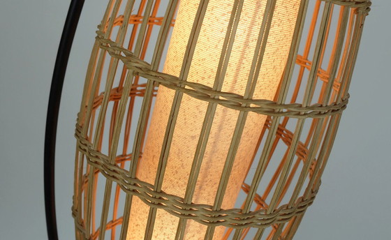 Image 1 of buitengewone en zeldzame Mid century FLOOR LAMP rotan vlechtwerk teak zwart metaal 1960