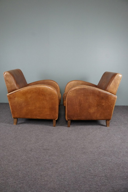 Set van twee rundleren fauteuils / armchairs