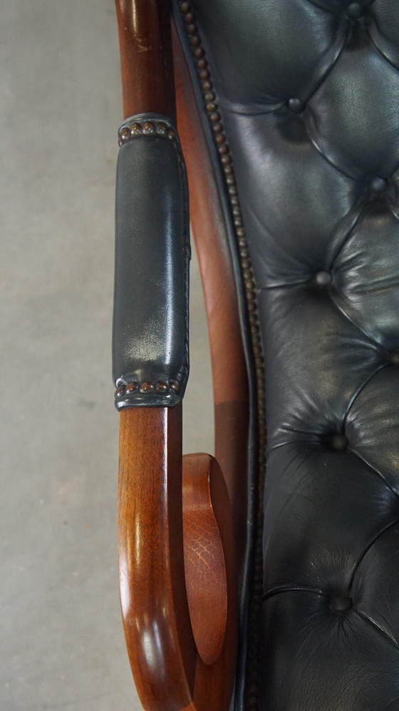 Image 1 of Donkerblauwe Chesterfield Fauteuil Gemaakt Van Rundleer En Gecombineerd Met Hout