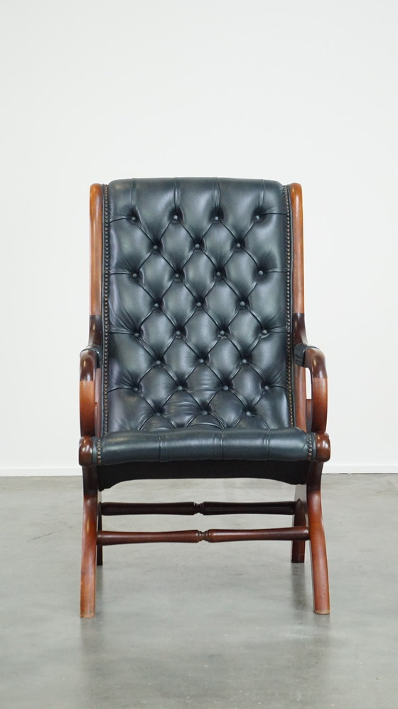 Image 1 of Donkerblauwe Chesterfield Fauteuil Gemaakt Van Rundleer En Gecombineerd Met Hout