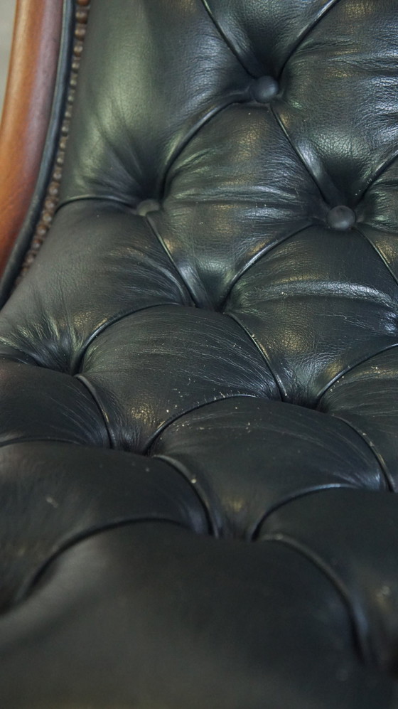 Image 1 of Donkerblauwe Chesterfield Fauteuil Gemaakt Van Rundleer En Gecombineerd Met Hout